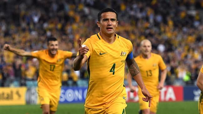 Tim Cahill of Australia (C) celebrates with teammates