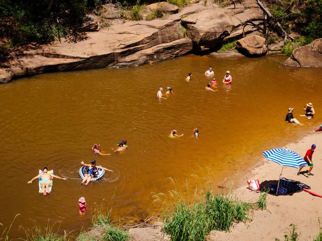 People cooling off at the Jellybean Pool in the Blue Mountains National Park at Glenbrook as the temperature hits 44 degrees at 12.10pm. Picture: Jonathan Ng