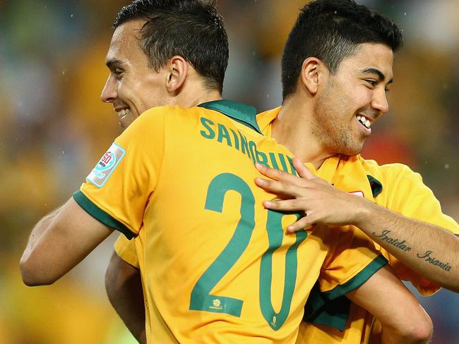 SYDNEY, AUSTRALIA - JANUARY 13: Trent Sainsbury and Massimo Luongo celebrate winning the 2015 Asian Cup match between Oman and Australia at ANZ Stadium on January 13, 2015 in Sydney, Australia. (Photo by Cameron Spencer/Getty Images)