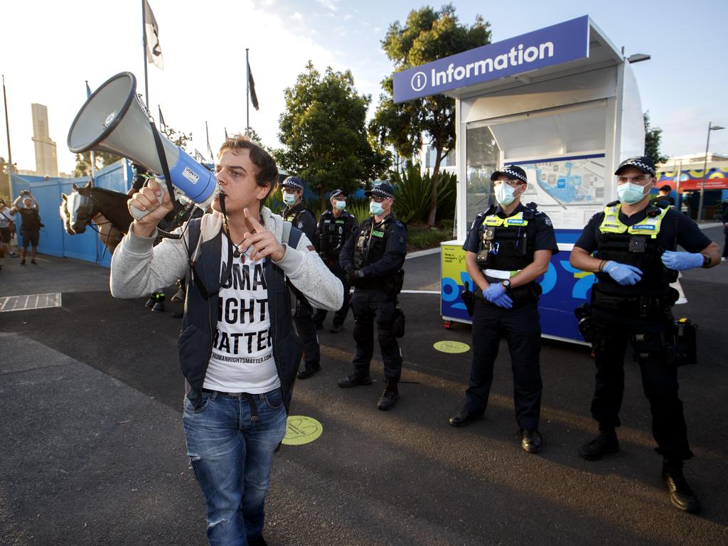 Anti-lockdown protesters march to the Australian Open at Melbourne Park on Friday evening Picture: David Geraghty