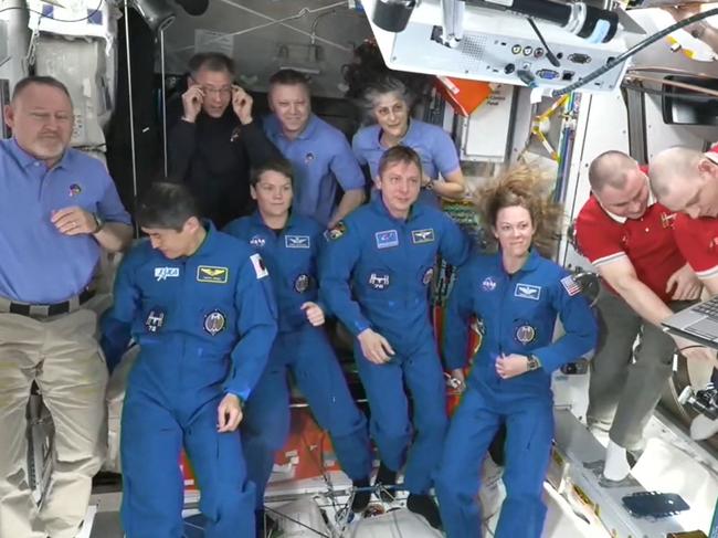 SpaceX Dragon Crew-10 members (C, in dark blue) NASA astronauts Anne McClain and Nichole Ayers, JAXA (Japan Aerospace Exploration Agency) astronaut Takuya Onishi, and Roscosmos cosmonaut Kirill Peskov, after entering the International Space Station flanked by NASA astronauts Butch Wilmore, Suni Williams, Nick Hague and Don Pettit and Russian cosmonauts Aleksandr Gorbunov, Alexey Ochinin and Ivan Vagner. Picture: NASA/AFP