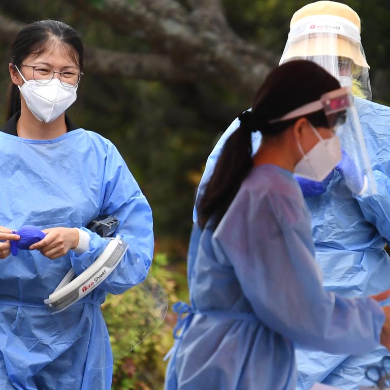 Health workers at a pop up COVID-19 testing clinic in Brisbane. Picture: NCA NewsWire / Dan Peled