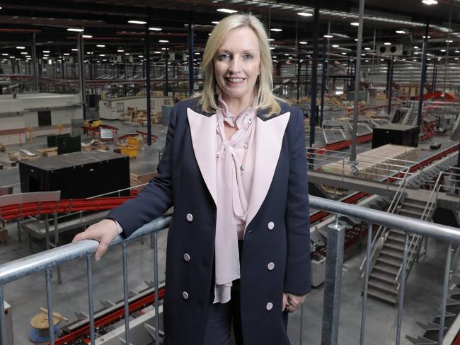 Christine Holgate inspecting a new parcels facility. Picture: Mark Cranitch.