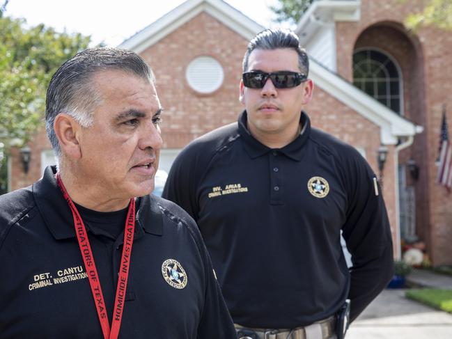 Detective Thomas Cantu, left, of the Fort Bend County Sheriff's Office talks to the press in the neighborhood where Brenton Estorffe was murdered in his home, in Katy, Texas. Picture: Scott Dalton