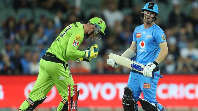 Travis Head shows his disappointment at being bowled on Saturday night against the Thunder. Picture: Robert Cianflone/Getty Images