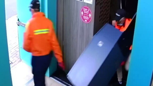 CCTV of the thieves dressed up as tradies as they walk out with up to $30,000 in a cash dispenser from the Junction Hotel on July 4. Picture: Supplied.