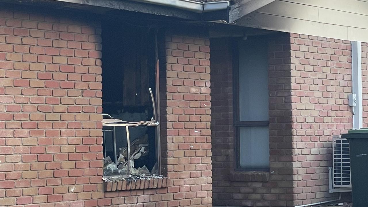 The fire caused a window near the front door to break.