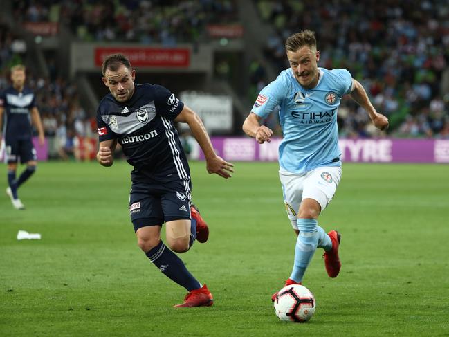 Melbourne Victory’s Leigh Broxham (left) and City’s Scott Jamieson will lock horns again in a feisty Round 1 derby.