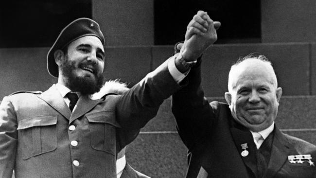 Cuba’s Fidel Castro (left) holds the hand of Soviet leader Nikita Khrushchev in 1963.