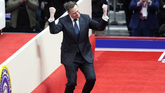 Elon Musk arrives on stage to speak at an indoor Presidential Inauguration parade event in Washington on January 20. Picture: AP