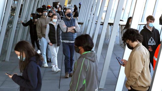 A long queue at the vaccination centre in Melbourne’s CBD. Picture: David Crosling