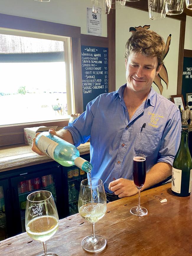 Dingo Creek Vineyard's Oliver O'Reilly pours out a sample.