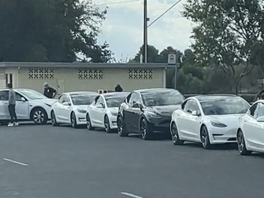 About 11 electric vehicles – mostly Teslas – were queued up along the Dukes Highway at Keith, South Australia . Picture: TikTok -  https://www.tiktok.com/@paulyohh83/video/7352782541281152257?_r=1&_t=8lD0DDRPQ4e