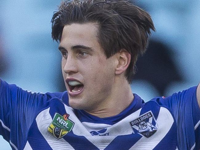 Lachlan Lewis of the Bulldogs kicks the winning field goal during the Round 23 NRL match between the Canterbury-Bankstown Bulldogs and the Warriors at ANZ Stadium in Sydney, Sunday, August 19, 2018. (AAP Image/Craig Golding) NO ARCHIVING, EDITORIAL USE ONLY