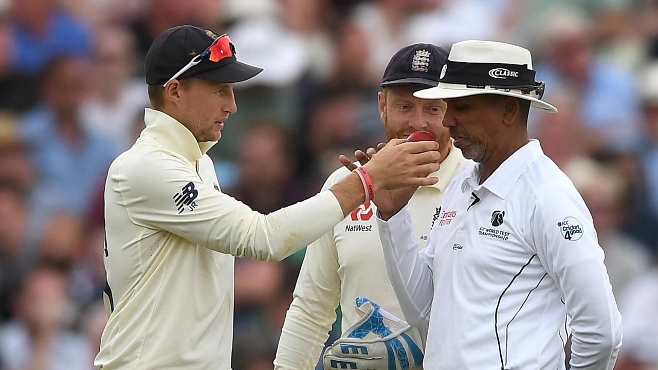 Joe Root has umpire Joel Wilson smell the ball during the first Test.