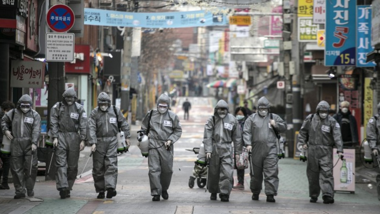 The virus had already spread to a number of countries, including South Korea, when DFAT was properly informed. Picture: Woohae Cho/Getty