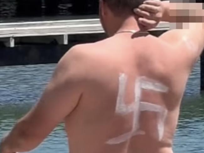 A man was spotted at a Perth beach with a Nazi swatstika painted on his back with sunscreen. Picture: Supplied