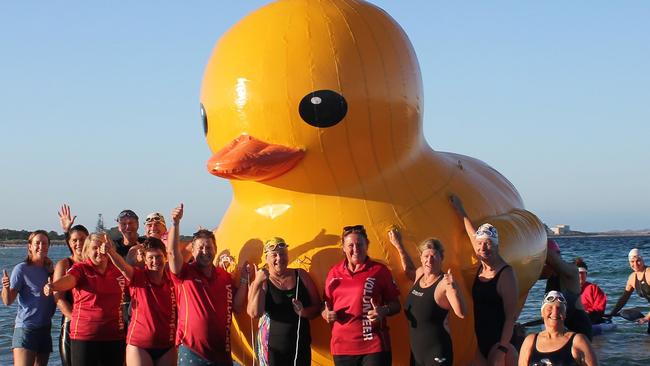 Members of Perth's Cockburn Masters Swimming Club with Daphne before she was swept out to see by strong winds. Picture: AFP