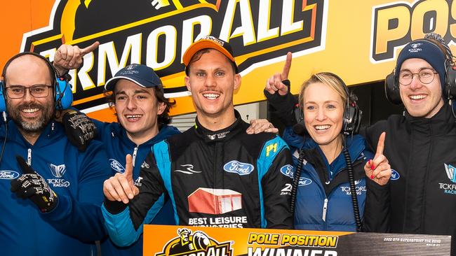 Zak Best, centre, celebrates with his team after taking pole position for race 1 of the OTR Supersprint round of the 2022 Supercars Championship Season at The Bend in July. Picture: Daniel Kalisz/Getty Images