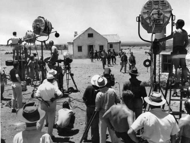 Shearers leave the hut and walk to the cookhouse during shooting of The Sundowners at Corunna sheep station, Iron Knob, South Australia in December 1959.