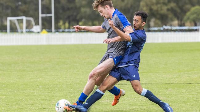 Matt Saxby and Indi Honan in the GPS First XI football match between Brisbane Grammar School and Anglican Church Grammar School earlier in the season. Picture: Richard Walker