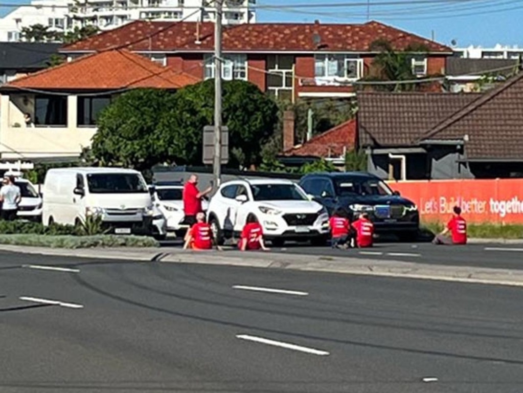 Fireproof Australia climate change protesters sat across three lanes on the Grand Parade at Brighton-Le-Sands in Sydney’s south on Tuesday morning. Picture: 2GB