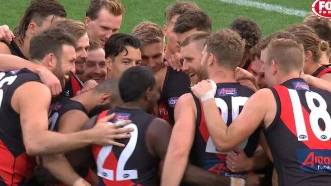 Essendon players find something to laugh about during their thumping by Geelong.