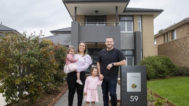 Dean and Renae Meager, pictured with daughters Evie and Layla, are selling their homes in Point Cook’s up-market Sanctuary Lakes estate with a $1.29m-$1.39m price guide. Picture: Aaron Francis