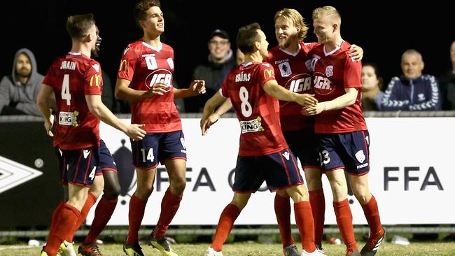 Adelaide United’s Jordan Elsey, right, is congratulated by teammates after scoring against Bentleigh Greens in their 2-0 FFA Cup semi-final win. Picture: Getty Images