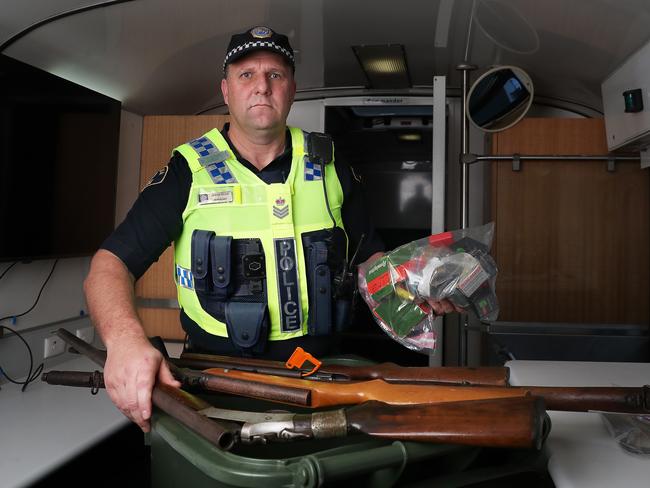 Senior Sergeant Jason Klug with the firearms and ammunition that were handed in as part of the amnesty day at Bridgewater. Picture: Nikki Davis-Jones