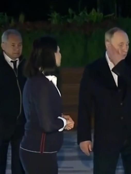 Putin pictured with Sergei Shoigu and his daughter.