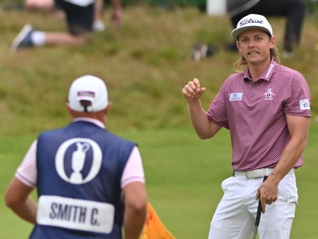 Australia's Cameron Smith celebrates after holing his final putt to make a birdie on the 18th green during his final round 64 on day 4 of The 150th British Open Golf Championship. Picture: AFP