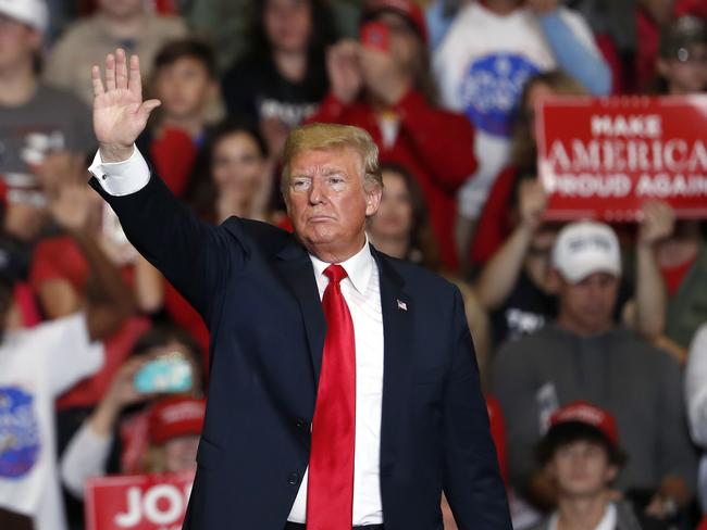 President Donald Trump waves to the crowd as he leaves the stage at the end of a campaign rally Monday, Nov. 5, 2018, in Cape Girardeau, Mo. (AP Photo/Jeff Roberson)