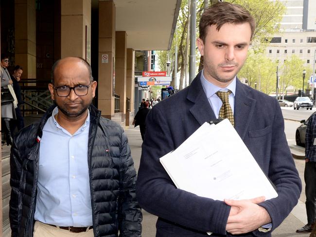 Madira Ginnige, the director of AIMS High Academy in Mount Waverley, leaves the Melbourne Magistrates Court after being charged with child sex offences. Picture: Andrew Henshaw