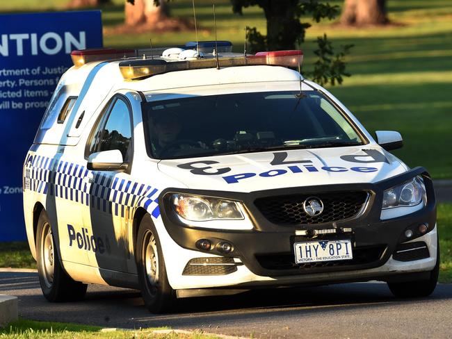 Police leave the Malmsbury Youth Justice centre .Picture:Rob Leeson.