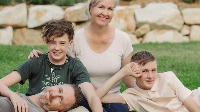 Jody Allen - The stay At Home Mum has published a new book - pictured here at home with her family: son in black t shirt: Flynn, 12 , Jody Allen, son in white polo shirt, Nate, 13 and husband Brendan Allen Picture: Jody Allen