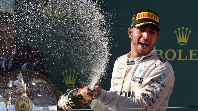 Lewis Hamilton spraying champagne after winning the 2015 Formula One Australian Grand Prix. Picture: AFP