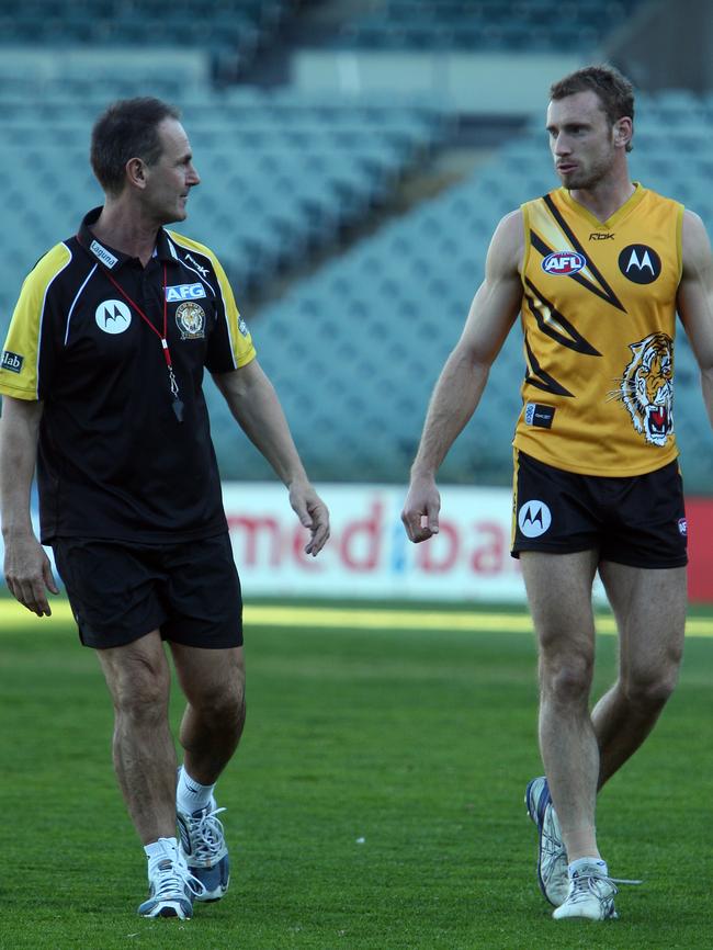 Terry Wallace and Shane Tuck chat before a Richmond game.