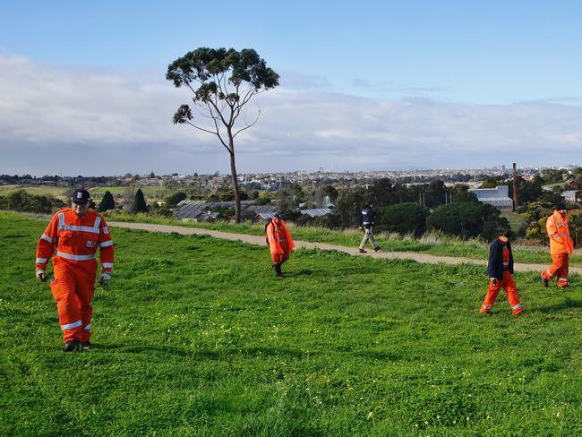 SES members search behind the Ristevski's house on Thursday. Picture: Hamish Blair