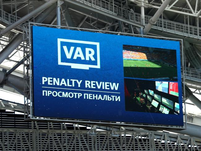 The big screen shows VAR reviewing a penalty decision for France. Pic: Getty