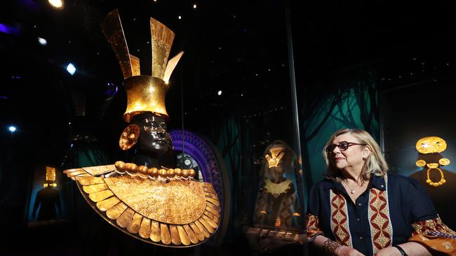 Australian Museum director Kim McKay with an exhibit of gold armour at the Machu Picchu and the Golden Empires of Peru exhibition. Picture: John Feder