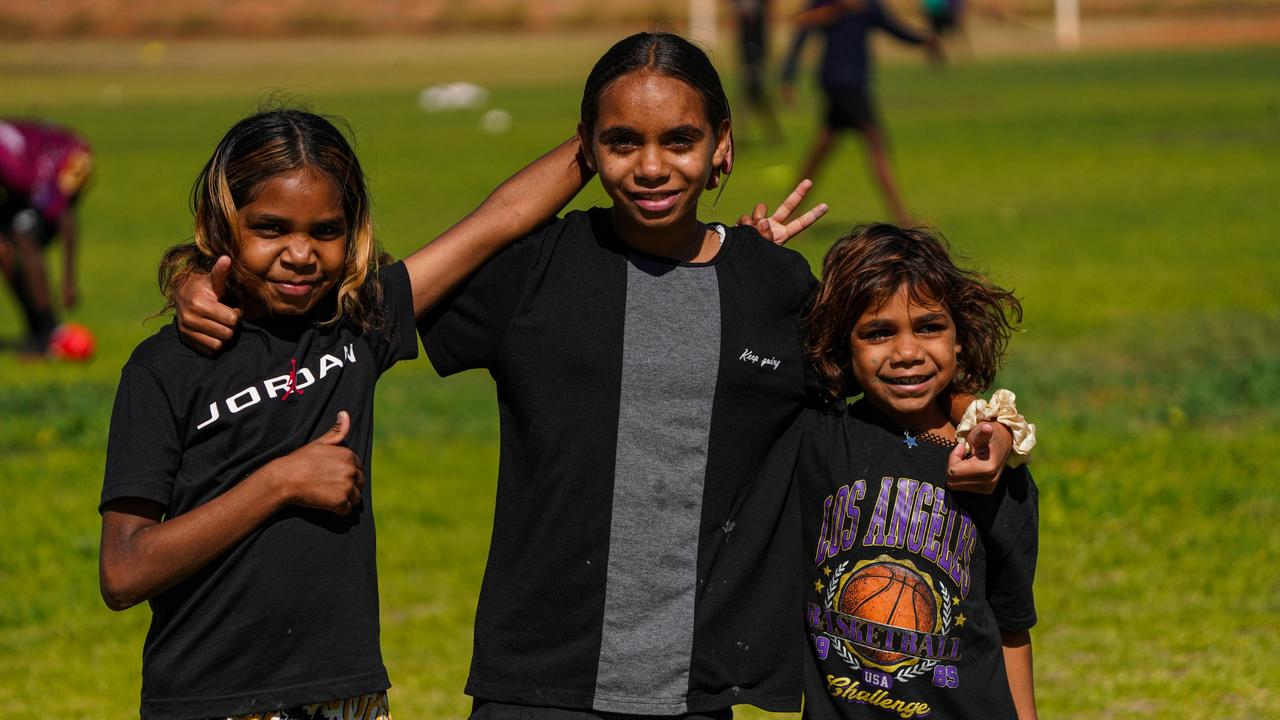 Melbourne Demons players Shane McAdam and Andy Moniz-Wakefield went to Santa Teresa ahead of the 2025 AFL game in Alice Springs. Picture: Melbourne Demons