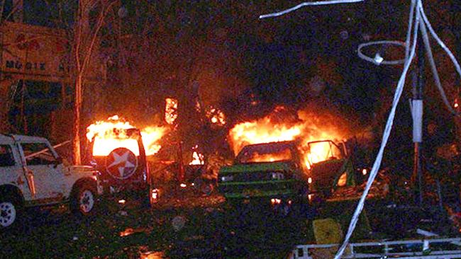 This file photo taken early on October 13, 2002, shows buildings and cars burning after bomb blasts in Kuta. Picture: AFP