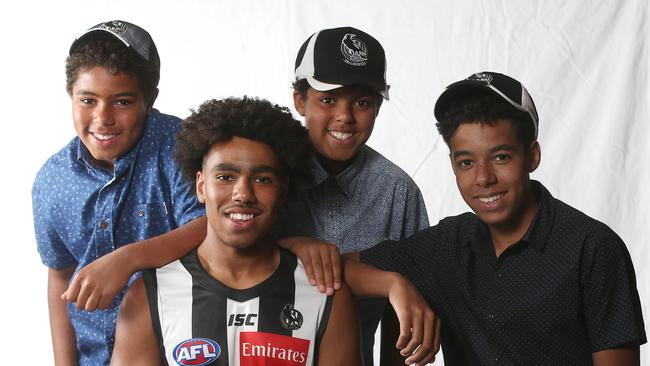 Quaynor with his brothers Luke, Matthew and Ben after being drafted. Picture: Michael Klein