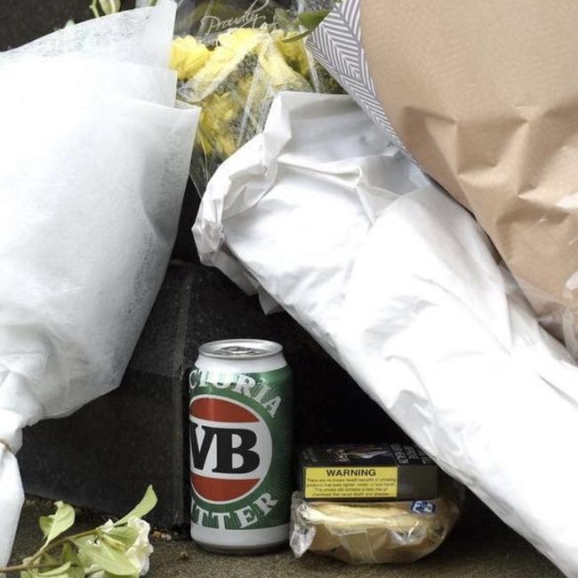 Flowers, ciggies, a pie and a can of VB at Warnie's statue at the MCG.