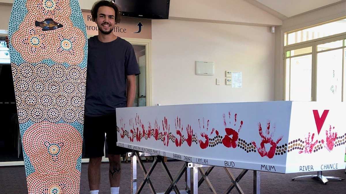 Aboriginal artist Kane Brunjes with Ashley Boney's coffin adorned with Aboriginal artwork. Picture: contributed