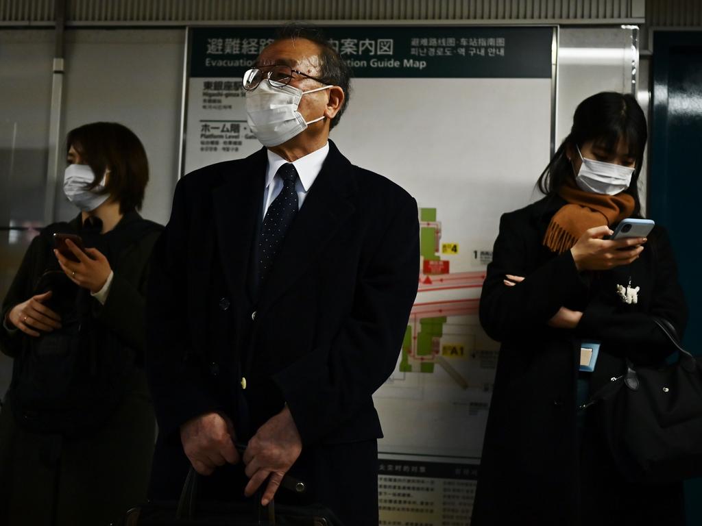 People wait for the train in Tokyo's Ginza area on February 17, 2020. Picture: Charly Triballeau/AFP