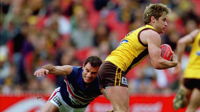 Tony Liberatore goes in to tackle Shane Crawford in 2001.