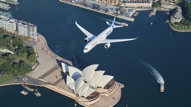 An Airbus A350-1000 flight test aircraft flies over Sydney Harbour on Monday.