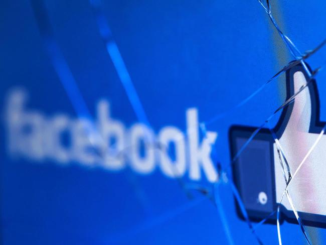 (FILES) In this file photo taken on May 16, 2018 shows the logo of the social network Facebook on a broken screen of a mobile phone. - Facebook said Thursday, November 15, 2018 it was severing ties with a political consultancy that sought to discredit critics of the social networking giant using questionable campaign-style tactics. The California-based company's announcement followed a lengthy New York Times investigation detailing Facebook's struggles with its image as it came under scrutiny for its handling of Russian-led misinformation efforts. Facebook said in a statement that "we ended our contract" with Definers Public Affairs, which specializes in opposition research and, according to the Times, sought to link anti-Facebook efforts to financier George Soros. But Facebook disputed claims that it used the firm in a nefarious way. (Photo by JOEL SAGET / AFP)